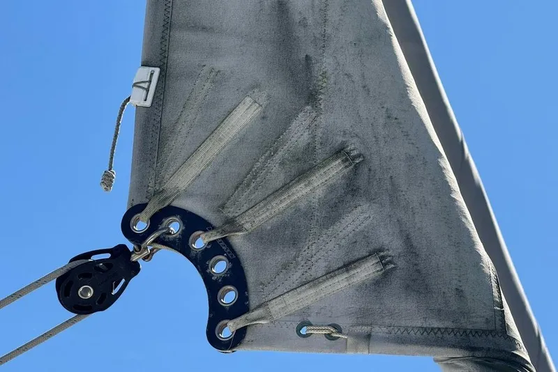 Slide: The Image of Close-up of Jeanneau Sun Odyssey 449 sail detail against clear blue sky. - 15