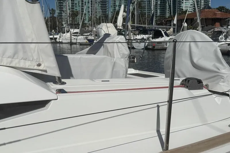 Slide: The Image of Jeanneau Sun Odyssey 449 sailboat, 2017 model, docked in a marina with covered equipment. - 19