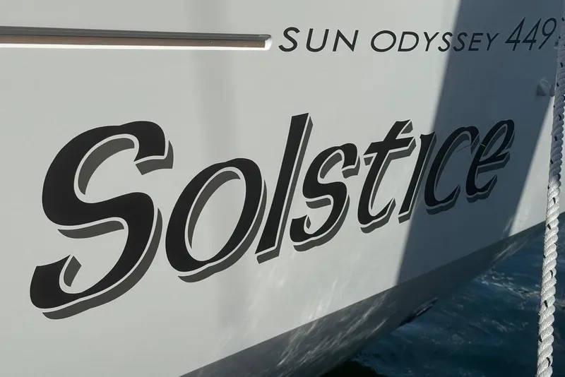 Slide: The Image of 2017 Jeanneau Sun Odyssey 449 sailboat named "Solstice" with bold lettering on the hull. - 20