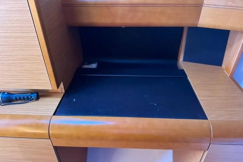Slide: The Image of Interior detail of 2017 Jeanneau Sun Odyssey 449 yacht, featuring wooden cabinetry. - 28
