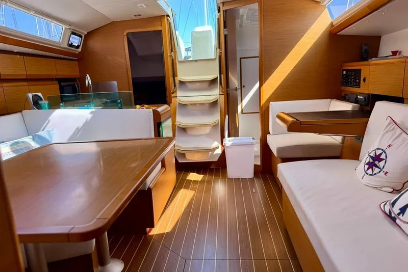 Slide: The Image of Interior of 2017 Jeanneau Sun Odyssey 449 yacht with wooden furnishings and cozy seating. - 30