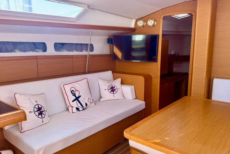 Slide: The Image of Interior of 2017 Jeanneau Sun Odyssey 449 yacht with cozy seating and nautical decor. - 35