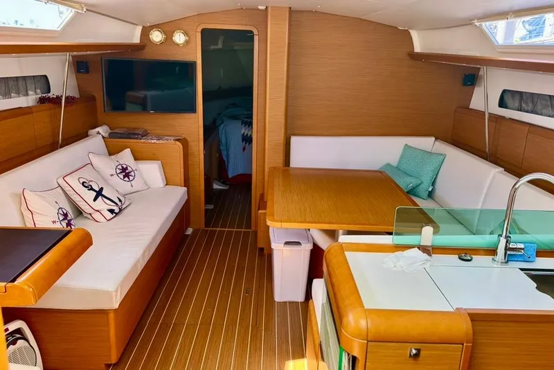 Slide: The Image of Interior of 2017 Jeanneau Sun Odyssey 449 yacht with cozy seating and modern kitchen. - 41