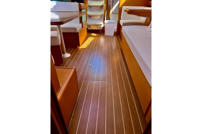 Slide: The Image of Interior of 2017 Jeanneau Sun Odyssey 449 yacht with elegant wood flooring and seating. - 52