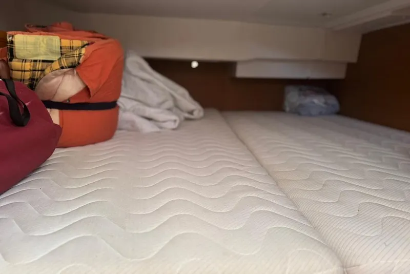 Slide: The Image of Interior cabin of 2017 Jeanneau Sun Odyssey 449 with neatly arranged bedding. - 58