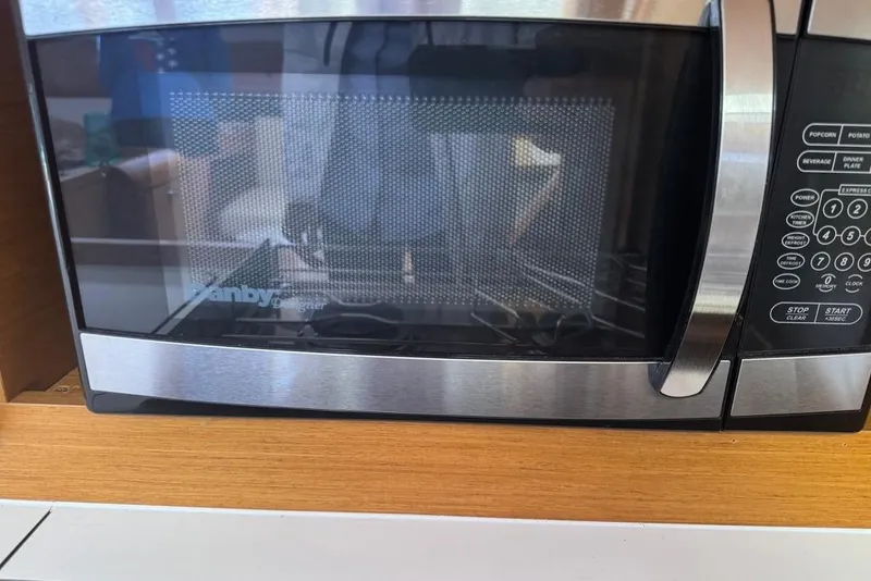 Slide: The Image of Microwave oven inside Jeanneau Sun Odyssey 449 yacht, 2017 model. - 61