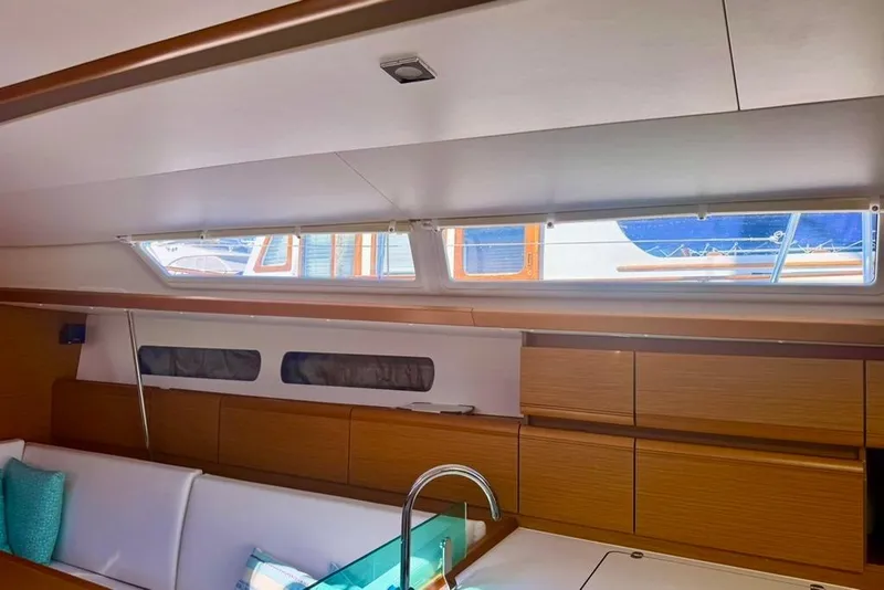 Slide: The Image of Interior of 2017 Jeanneau Sun Odyssey 449 yacht, featuring sleek wood cabinetry and modern design. - 64