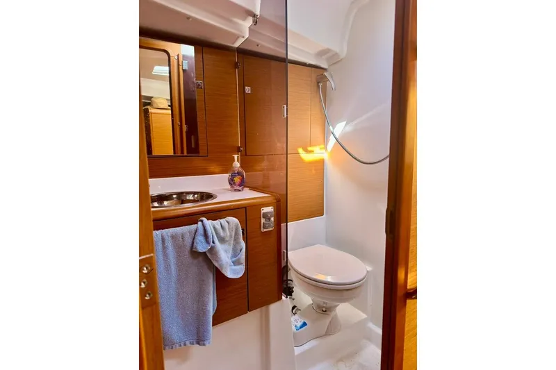 Slide: The Image of Bathroom interior of 2017 Jeanneau Sun Odyssey 449 yacht, featuring sink and toilet. - 70