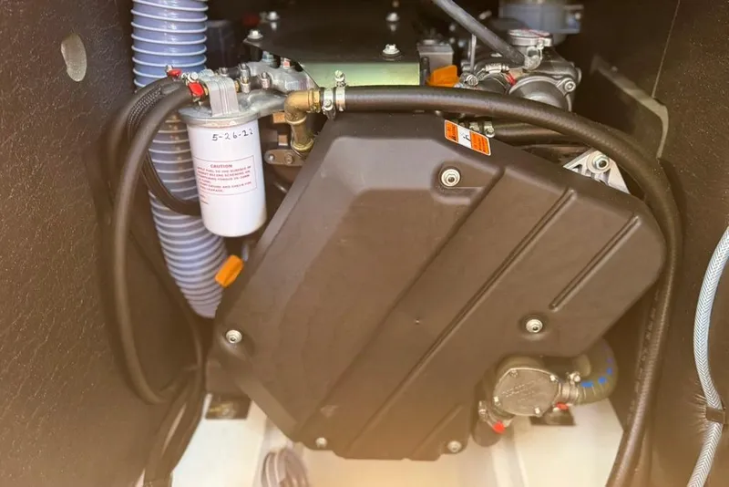 Slide: The Image of Engine compartment of a 2017 Jeanneau Sun Odyssey 449 sailboat, showcasing mechanical components. - 72