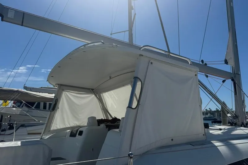 Slide: The Image of 2017 Jeanneau Sun Odyssey 449 sailboat with white canopy under clear blue sky. - 8