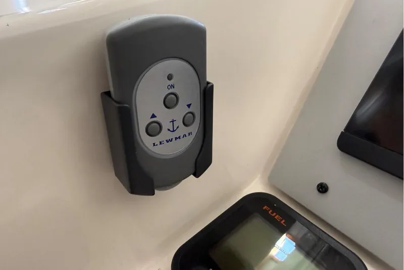 Slide: The Image of Lewmar remote control on 2007 Pursuit C 310 Center Console boat dashboard. - 16