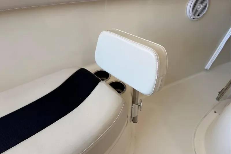 Slide: The Image of 2007 Pursuit C 310 Center Console boat seat with cup holders and speaker. - 20