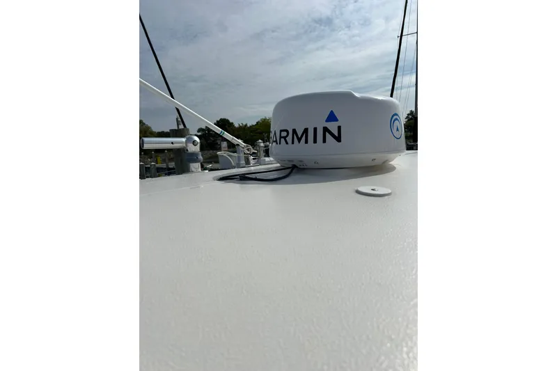 Slide: The Image of 2007 Pursuit C 310 Center Console with Garmin radar on deck. - 26