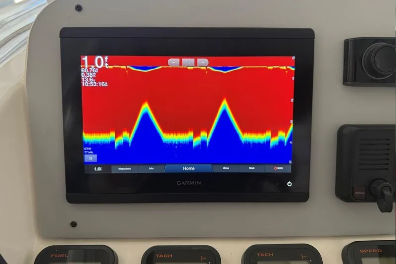 Slide: The Image of Garmin fishfinder display on 2007 Pursuit C 310 Center Console boat dashboard. - 33