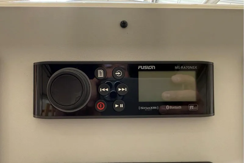 Slide: The Image of Fusion MS-RA70NSX marine stereo on 2007 Pursuit C 310 Center Console. - 36