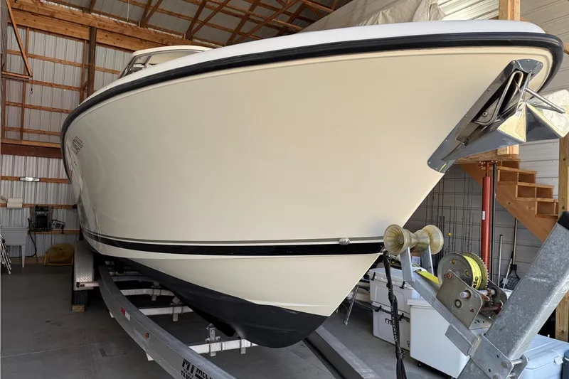 Slide: The Image of 2007 Pursuit C 310 Center Console boat on trailer in storage facility. - 45