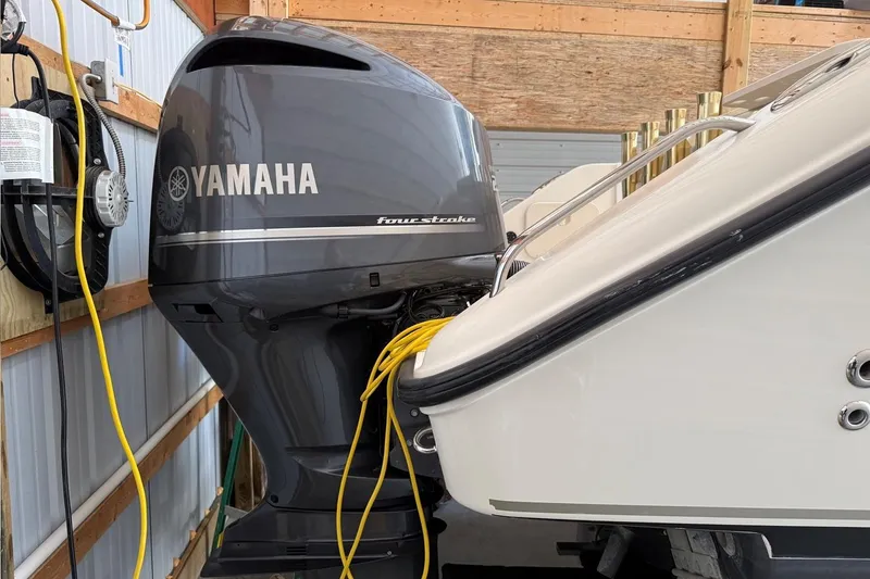 Slide: The Image of 2007 Pursuit C 310 Center Console with Yamaha four-stroke engine in storage. - 46