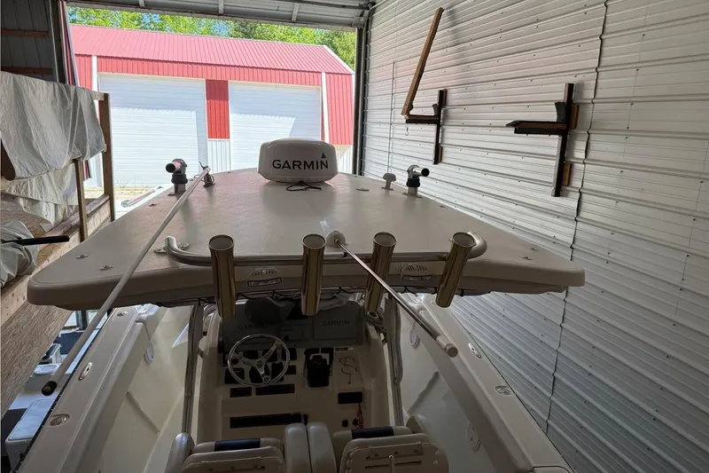 Slide: The Image of 2007 Pursuit C 310 Center Console boat in storage with Garmin equipment. - 50