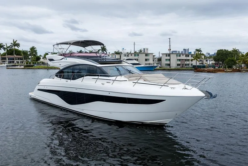 The Image of Luxurious 2020 Princess S62 yacht docked in a serene waterfront setting. - 0