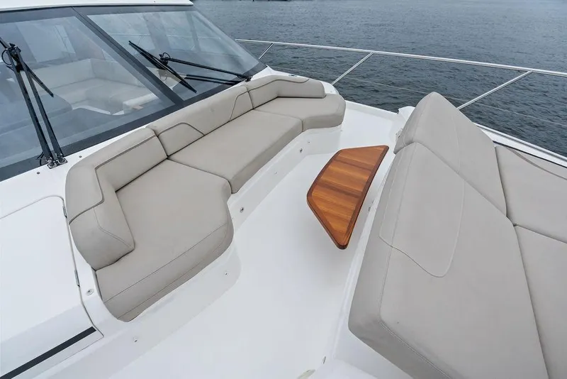 Slide: The Image of Luxurious seating area on 2020 Princess S62 yacht with elegant beige cushions. - 14