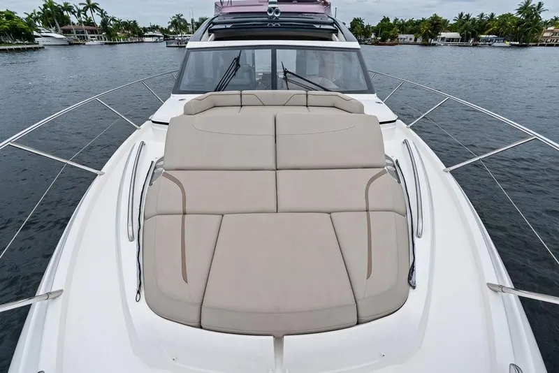 Slide: The Image of Luxury 2020 Princess S62 yacht with spacious sunbed on deck, cruising on calm waters. - 15