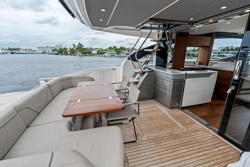 Slide: The Image of Luxurious 2020 Princess S62 yacht deck with seating, table, and modern interior. - 33