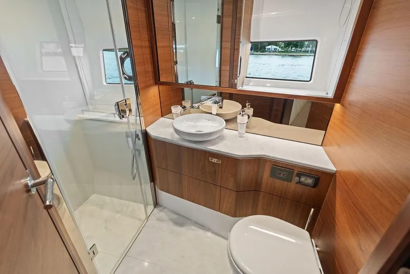 Slide: The Image of Luxurious bathroom in 2020 Princess S62 yacht with wood accents and modern fixtures. - 60