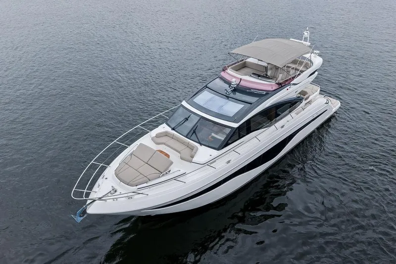 Slide: The Image of Luxury 2020 Princess S62 yacht cruising on calm waters. - 9