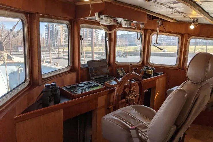 Slide: The Image of 1977 Commercial Expedition Trawler helm with steering wheel, controls, and panoramic windows. - 8