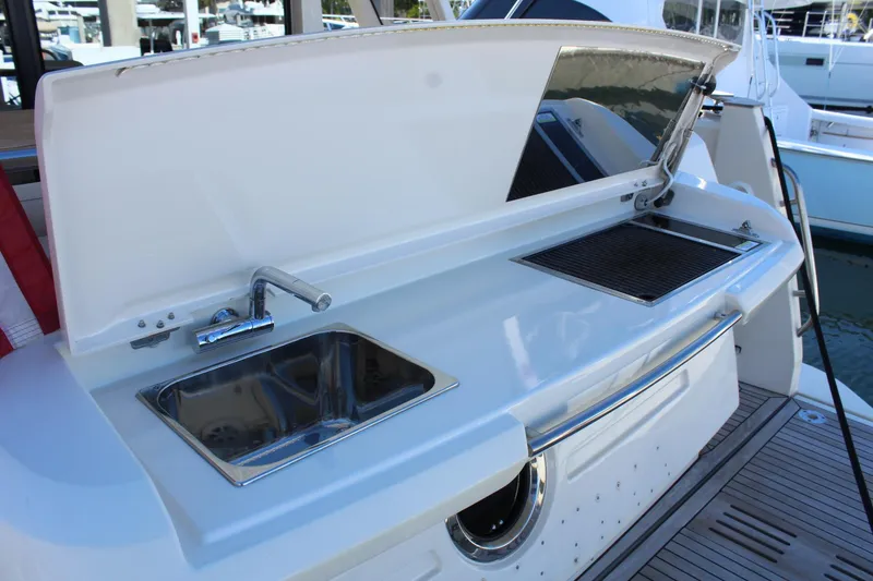 Slide: The Image of Kitchen area on a 2019 Greenline 48 Coupe yacht. - 10