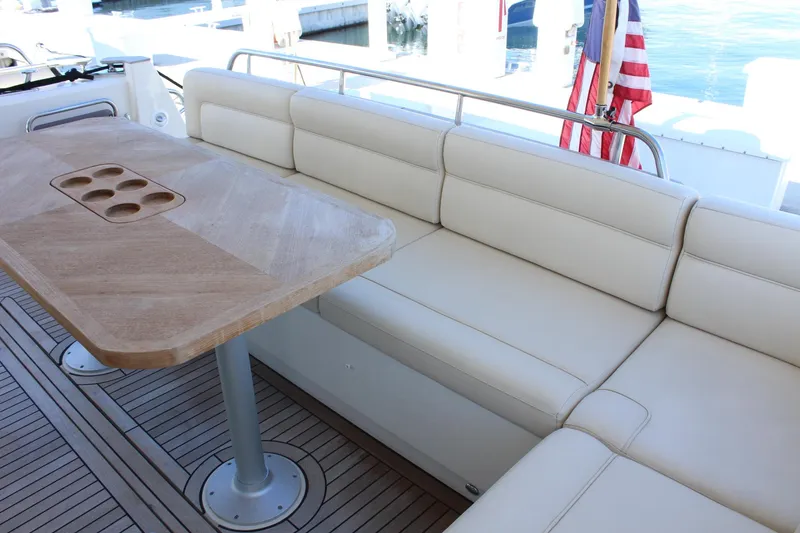 Slide: The Image of Interior of 2019 Greenline 48 Coupe with wooden table and leather sofa. - 12