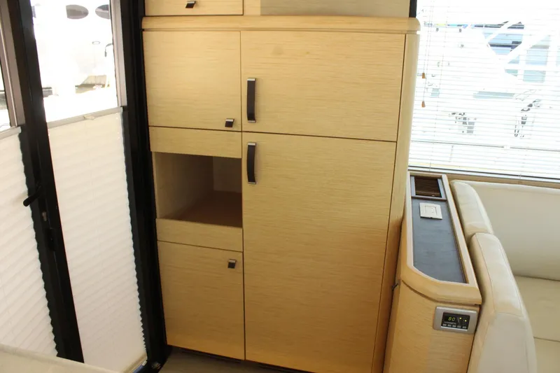 Slide: The Image of Interior of 2019 Greenline 48 Coupe with wooden cabinets. - 15