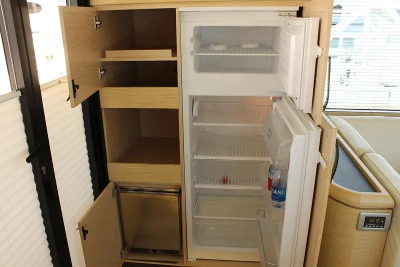 Slide: The Image of Interior view of refrigerator in 2019 Greenline 48 Coupe. - 16