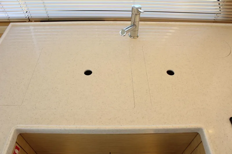 Slide: The Image of Kitchen countertop in 2019 Greenline 48 Coupe with faucet. - 17