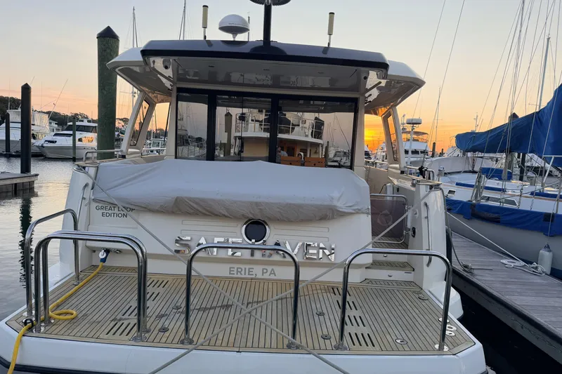 Slide: The Image of 2019 Greenline 48 Coupe yacht docked at sunset, Erie, PA marina. - 2