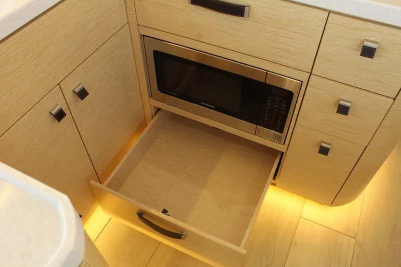 Slide: The Image of Interior of 2019 Greenline 48 Coupe with microwave and drawer. - 20