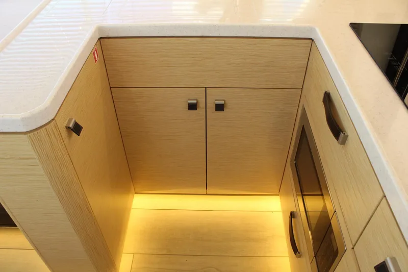 Slide: The Image of Interior of 2019 Greenline 48 Coupe featuring modern kitchenette. - 21