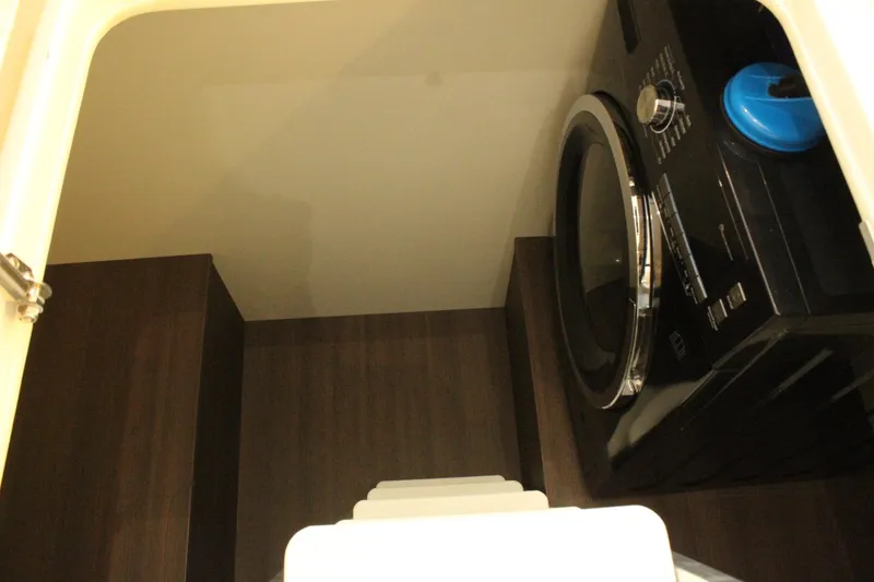 Slide: The Image of Washing machine inside the 2019 Greenline 48 Coupe yacht. - 25