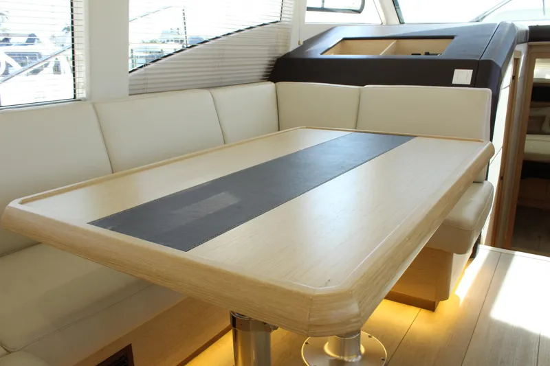 Slide: The Image of Interior of 2019 Greenline 48 Coupe with modern dining table. - 27