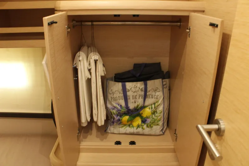 Slide: The Image of Closet in 2019 Greenline 48 Coupe with hangers and bag. - 38