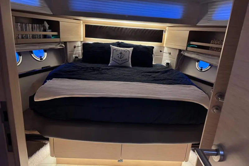 Slide: The Image of Luxurious bedroom interior of 2019 Greenline 48 Coupe yacht with cozy bedding and ambient lighting. - 44