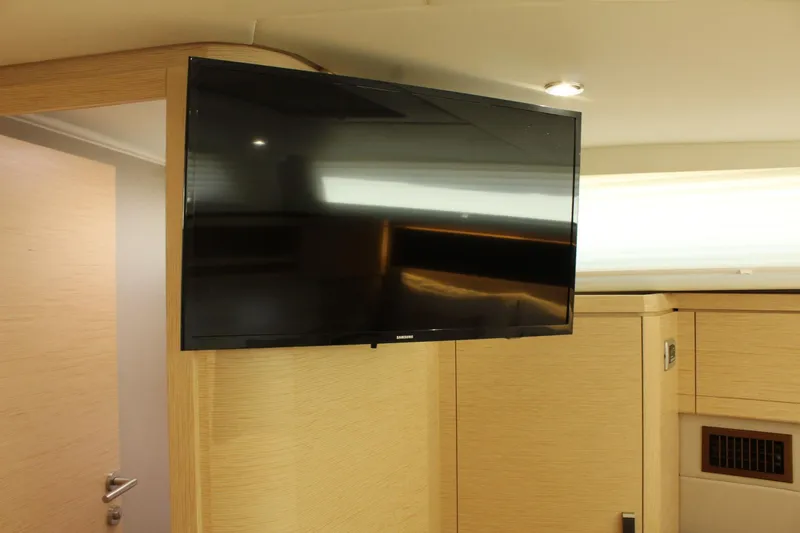 Slide: The Image of Interior of 2019 Greenline 48 Coupe featuring wall-mounted TV. - 47