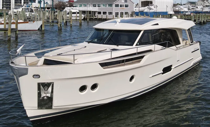 Slide: The Image of 2019 Greenline 48 Coupe yacht docked at harbor. - 7