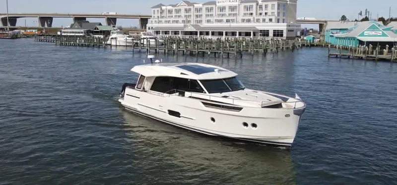 Slide: The Image of 2019 Greenline 48 Coupe yacht in harbor near docks. - 8