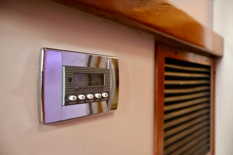 Slide: The Image of Thermostat control panel on 1994 Luhrs 32 Convertible boat interior. - 42