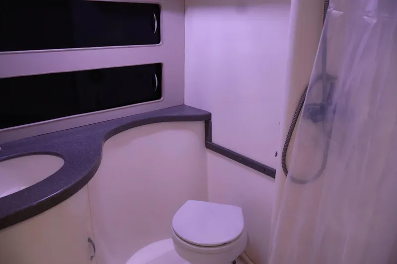 Slide: The Image of Bathroom interior of 1994 Luhrs 32 Convertible boat with shower and toilet. - 44