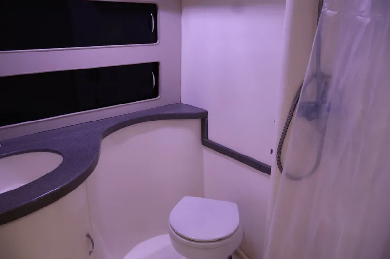 Slide: The Image of Bathroom interior of 1994 Luhrs 32 Convertible boat with toilet and shower. - 63