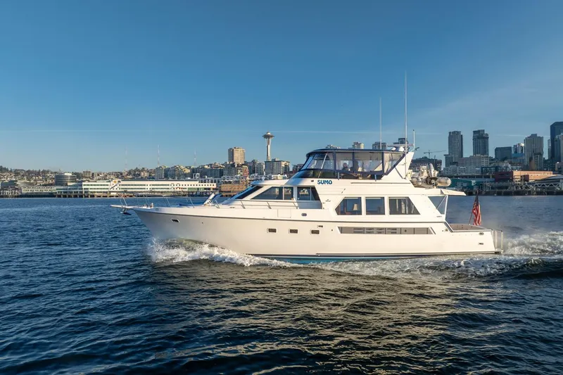 Slide: The Image of 1991 Tollycraft 57 Pilothouse Motor Yacht cruising near city skyline. - 3
