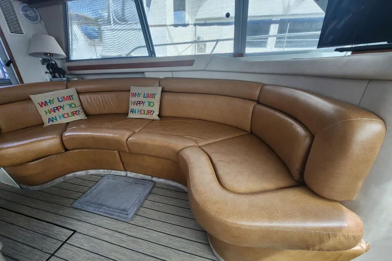 Slide: The Image of Luxurious leather seating in 1996 Sea Ray 370 Sedan Bridge yacht interior. - 14