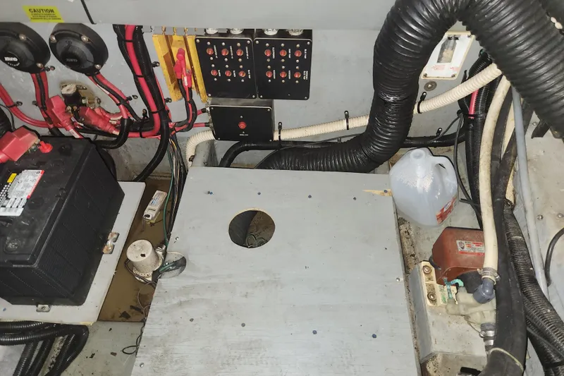 Slide: The Image of Engine room of a 1996 Sea Ray 370 Sedan Bridge with wiring and components. - 23